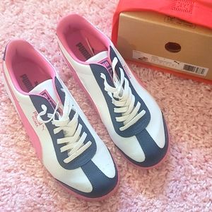 Puma Juniors shoe. Size 7. Gently worn. Nice shoe.  Pink, navy pumas. With box.